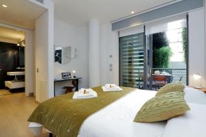 Кровать или кровати в номере Rome Unique Monti Colosseum