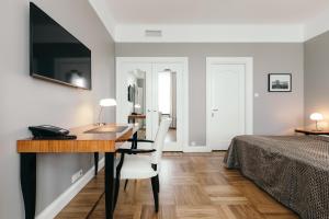 Telewizja i/lub zestaw kina domowego w obiekcie Hotel Borg by Keahotels