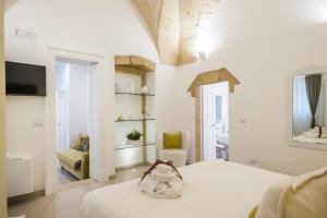 A bed or beds in a room at Amatè Suite