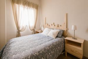 Postel nebo postele na pokoji v ubytování Alameda Amor Suite by Valcambre