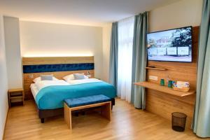 
Ein Bett oder Betten in einem Zimmer der Unterkunft Hotel & Restaurant Hofmatt
