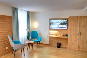 TV i/ili multimedijalni sistem u objektu Hotel & Restaurant Hofmatt