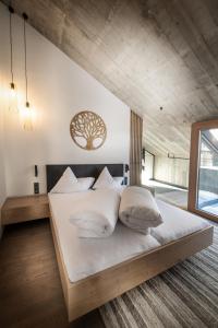 Postel nebo postele na pokoji v ubytování Glanz & Glory Appartements Längenfeld + 37 fotografií