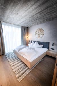 Postel nebo postele na pokoji v ubytování Glanz & Glory Appartements Längenfeld