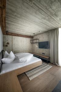 Postel nebo postele na pokoji v ubytování Glanz & Glory Appartements Längenfeld