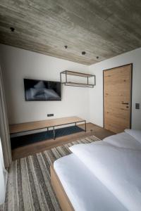 Postel nebo postele na pokoji v ubytování Glanz & Glory Appartements Längenfeld