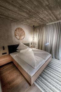 Postel nebo postele na pokoji v ubytování Glanz & Glory Appartements Längenfeld