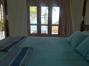 Säng eller sängar i ett rum på Star Beach Hotel