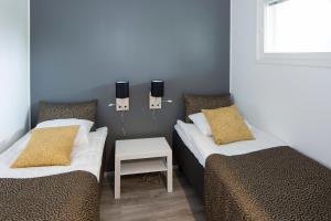 Кровать или кровати в номере Holiday Club Salla Superior Apartments +28 фотографий