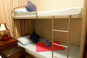 Postel nebo postele na pokoji v ubytování Connecting Flight Mactan Cebu Hostel