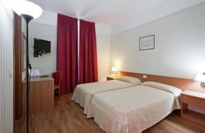 Voodi või voodid majutusasutuse Hotel Fortuna toas