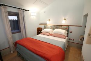 A bed or beds in a room at Casa Minotti Relais