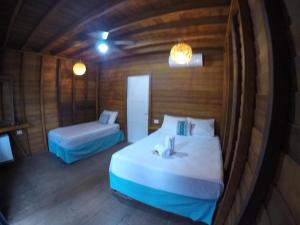 Postel nebo postele na pokoji v ubytování Hotelito Villas Holbox