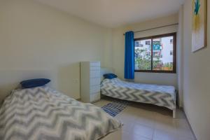 Ліжко або ліжка в номері Seguro Spacious apartment with roomy terrace