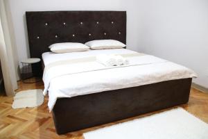 Ένα ή περισσότερα κρεβάτια σε δωμάτιο στο Tania Apartament +10 φωτογραφίες