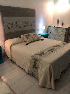 Postel nebo postele na pokoji v ubytování Hotel Canne al Vento