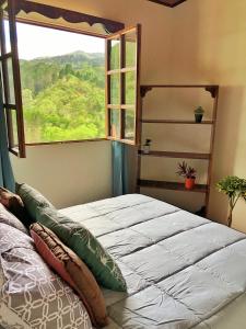 Postel nebo postele na pokoji v ubytování Cabaña Vista Verde