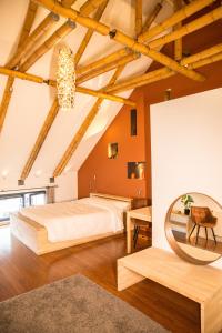 a bedroom with a large bed and a table at BNB Nest in Ghent