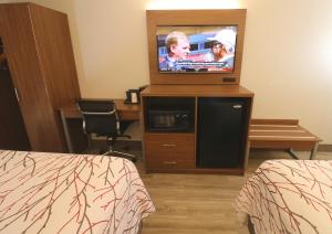 Hotel LeBlanc Best Western Signature Collection的电视和/或娱乐中心