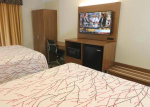 Hotel LeBlanc Best Western Signature Collection客房内的一张或多张床位