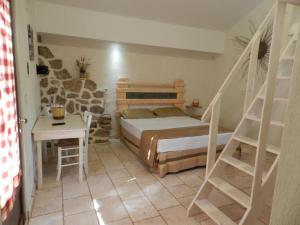 a bedroom with a bed and a ladder in it at Macchia Salentina in Baia Di Gallipoli +99 photos