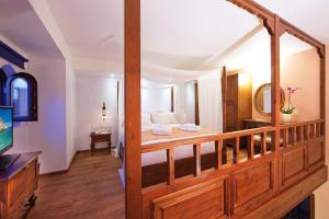 A bed or beds in a room at In Camera Art Boutique Hotel
