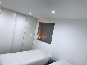 Posteľ alebo postele v izbe v ubytovaní Appartement agréable et moderne - Rez de chaussée - Blainville Sur L'Eau