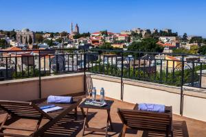 A balcony or terrace at In Camera Art Boutique Hotel