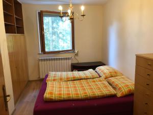 Un pat sau paturi într-o cameră la Glückliche Elfen