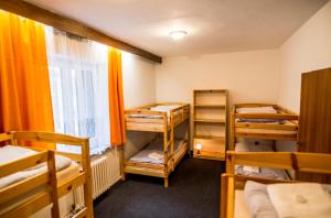 Postel nebo postele na pokoji v ubytování Horský hotel Kozubová