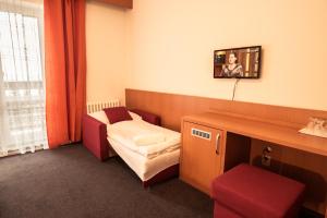 Postel nebo postele na pokoji v ubytování Horský hotel Kozubová
