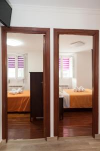 Posteľ alebo postele v izbe v ubytovaní Apartamento Algalia Catedral