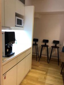 A cozinha ou kitchenette de Homy Residence