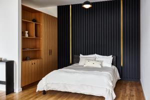 Ένα ή περισσότερα κρεβάτια σε δωμάτιο στο Lokal Hotel Fishtown