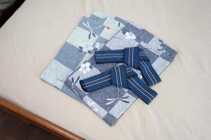 two blue ties sitting on top of a table at Beach Side Inn Shirahama in Shimoda