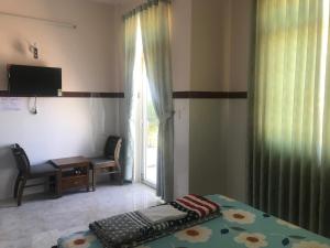 TV a/nebo společenská místnost v ubytování Hoang Minh 846 Hostel + 37 fotografií