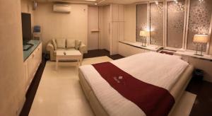 Ένα ή περισσότερα κρεβάτια σε δωμάτιο στο Prime Hotel Fulula プライムホテル フルーラ +4 φωτογραφίες