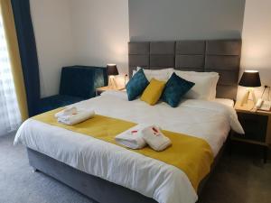 Postel nebo postele na pokoji v ubytování Atva Residence Hotel