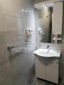 Koupelna v ubytování Atva Residence Hotel