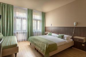 Postel nebo postele na pokoji v ubytování Hotel Superior Prague