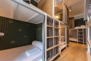 a room with bunk beds in a hostel at Boxpackers Hostel Phranakorn in Bangkok