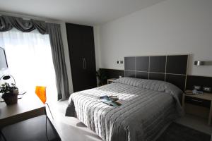 Letto o letti in una camera di Hotel Garnì Corallo