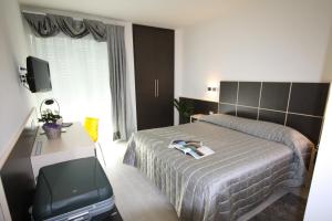 Letto o letti in una camera di Hotel Garnì Corallo