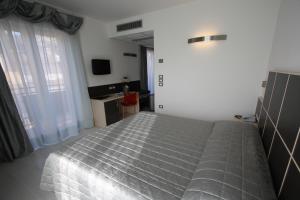 Letto o letti in una camera di Hotel Garnì Corallo