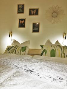 a bedroom with two beds and two pictures on the wall at City by BestChoice - FREE Parking - Self Check-in in Graz