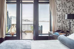 Postel nebo postele na pokoji v ubytování Ercilla Embarcadero Hotel