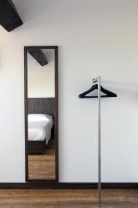 a bedroom with a mirror and a bed at My Bed in Milan