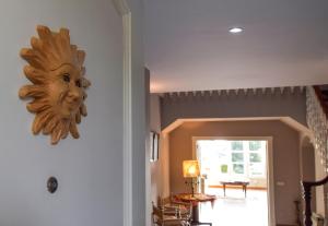 a mask hanging on the wall of a room at Villa Antumalal B&B in Málaga