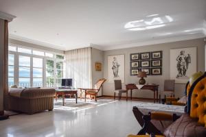 a living room with a couch and a table at Villa Antumalal B&B in Málaga