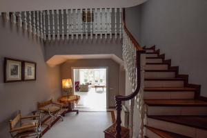 a staircase in a home with a stair case at Villa Antumalal B&B in Málaga
